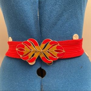 Vintage women red/gold buckle, stretch red 2” elastic band. Size waist 28”. Used